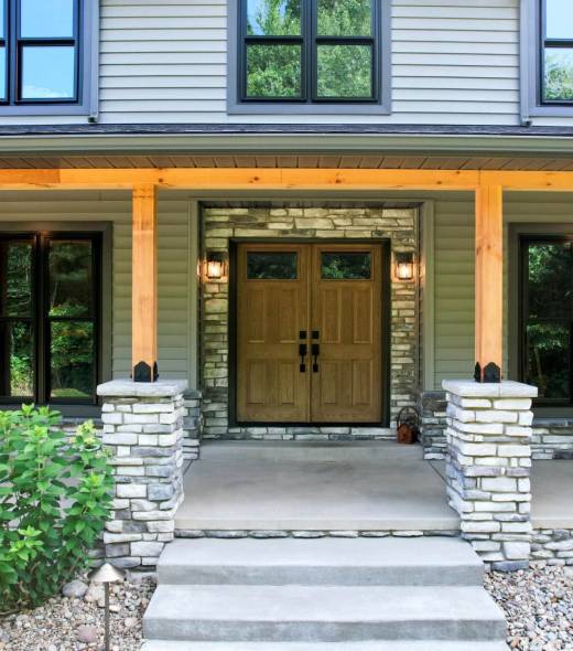 Home with large windows and beautiful double door entrance